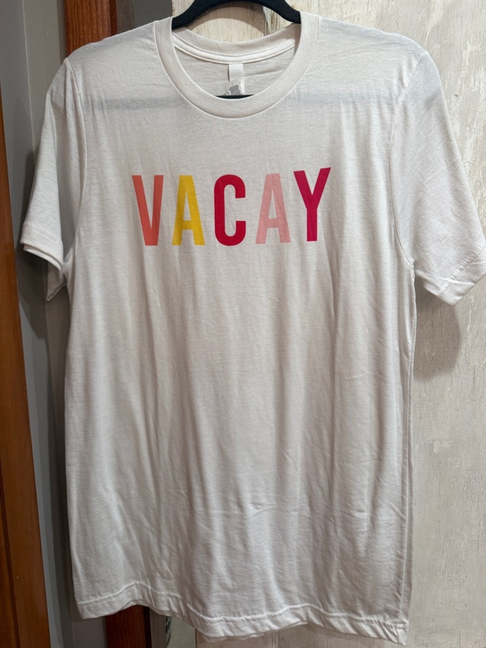 Bella Canvas White "VACAY" Short Sleeve Tee with Pink, Yellow & Red Lettering